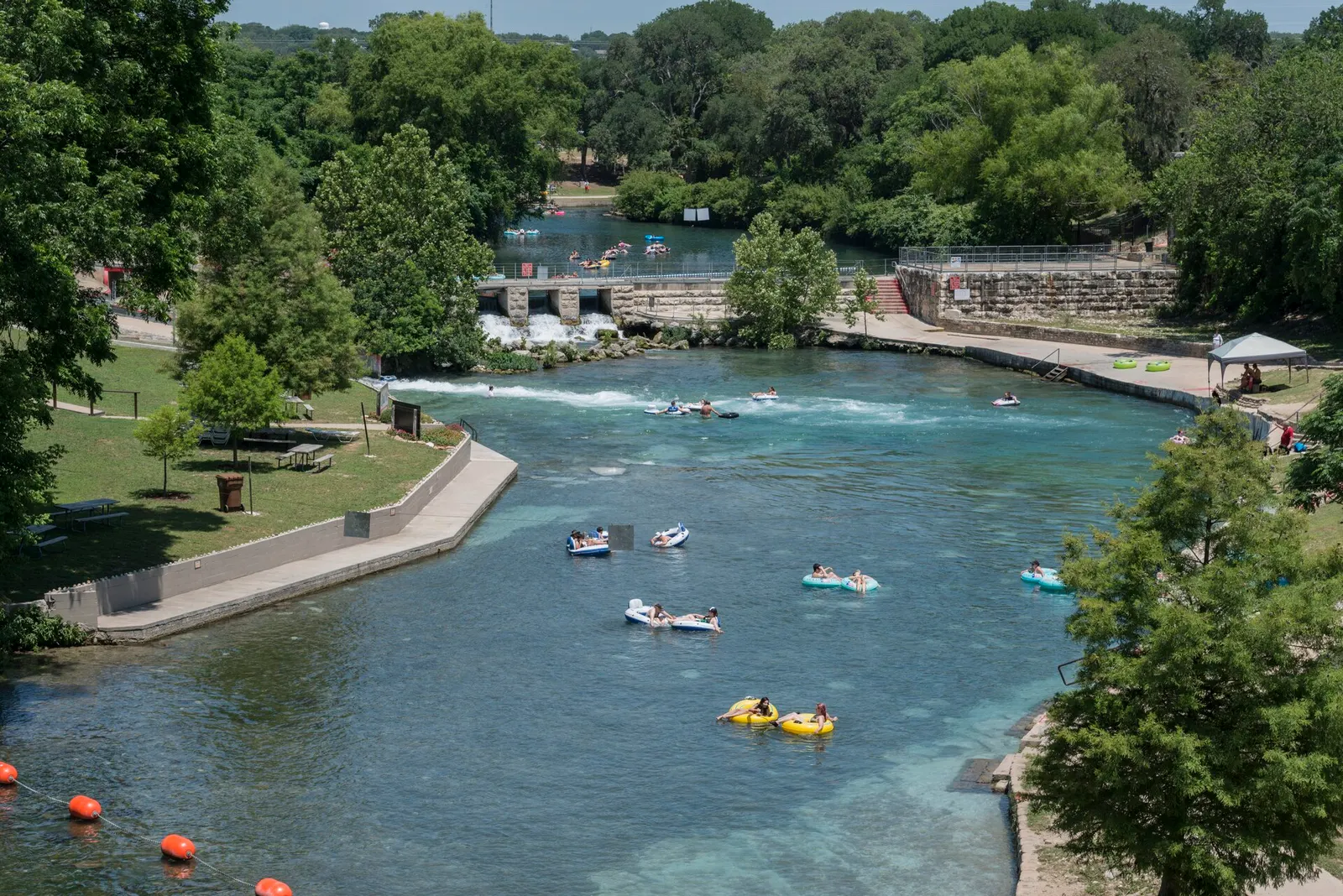Families tubing the Comal River at Prince Solms Park in New Braunfels